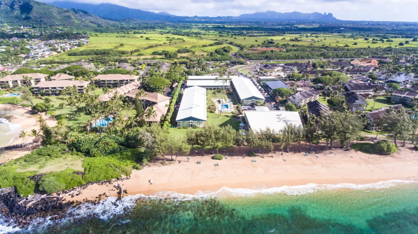 Aerial view of the beachfront resort grounds at Kauai Shores Hotel.