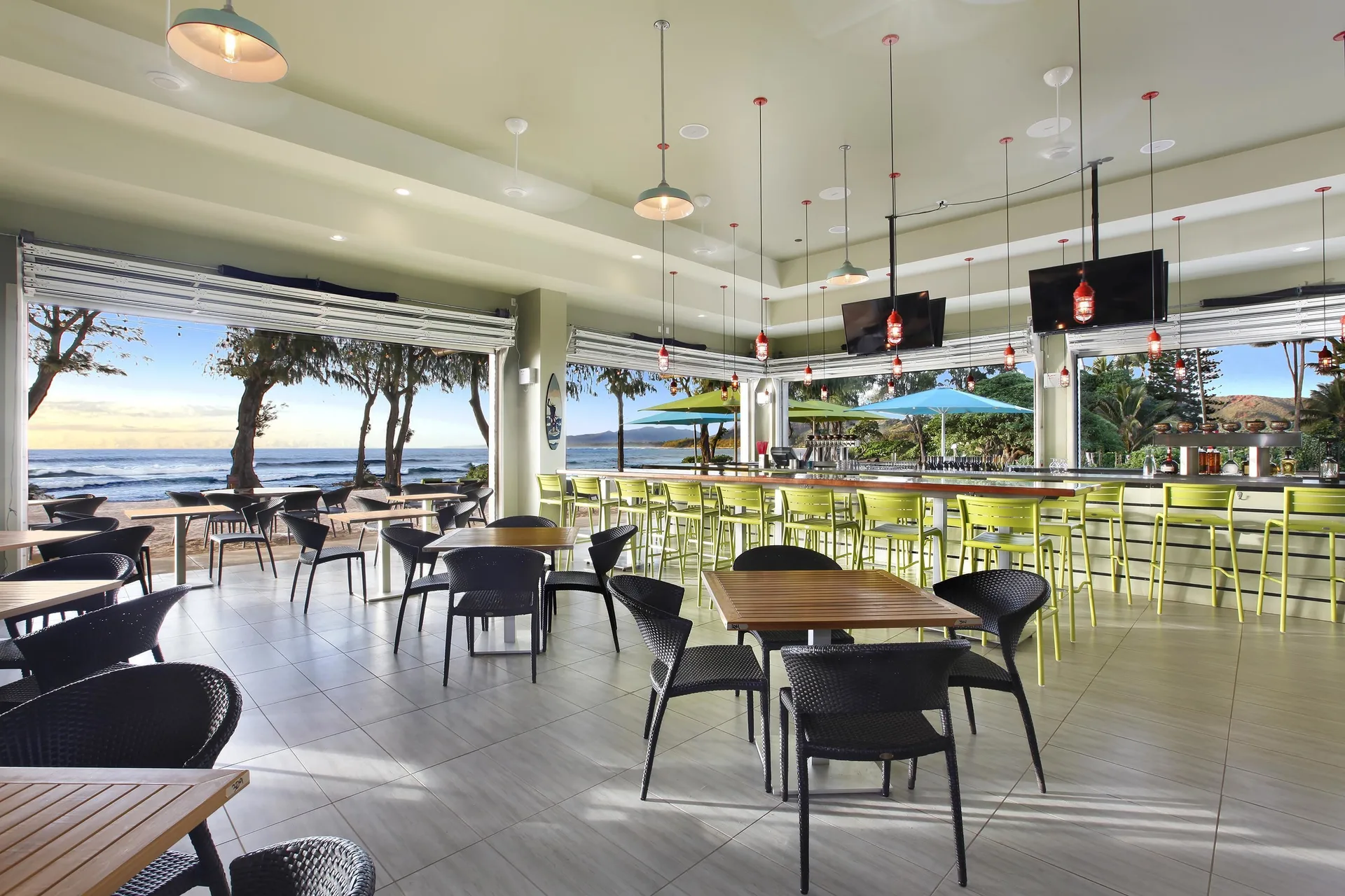 Open-air bar and dining room with ocean views at Kauai Shores Hotel.