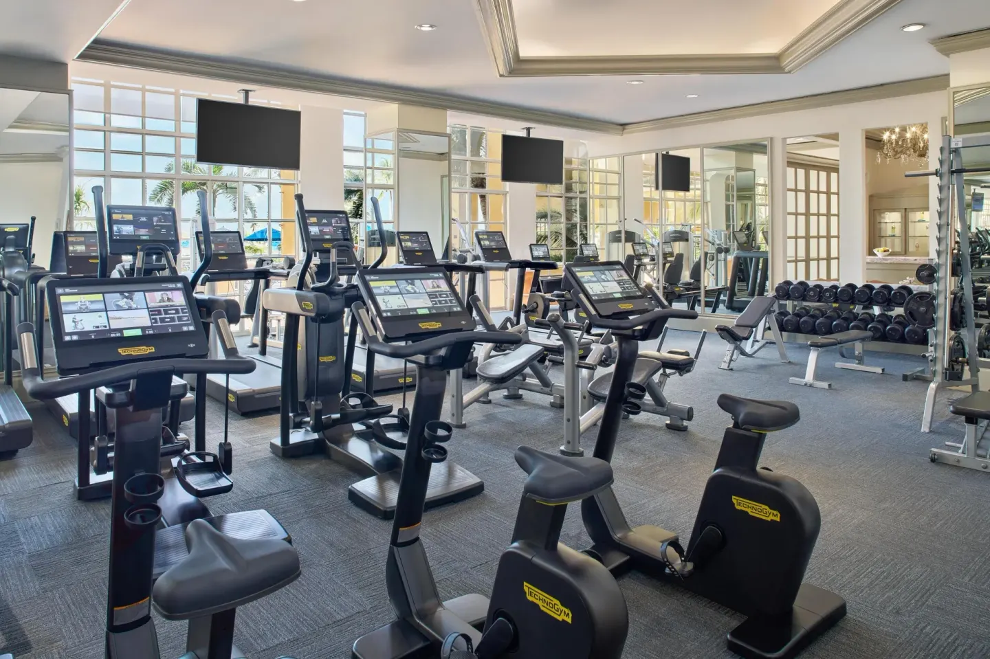 Exercise bikes, treadmills, weights and mirrors fill the gym at Kempinski Hotel Cancún.