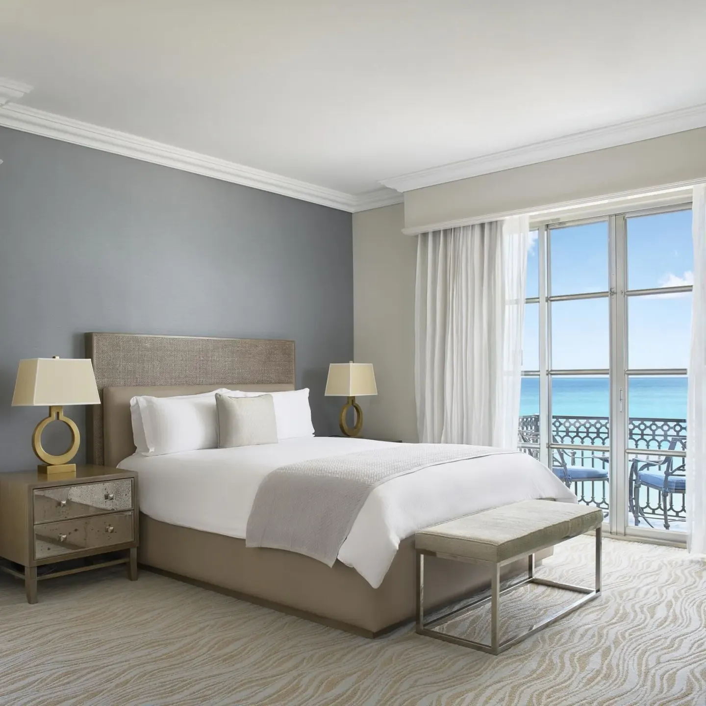 Ocean-view guest room with king bed and balcony at Kempinski Hotel Cancún.