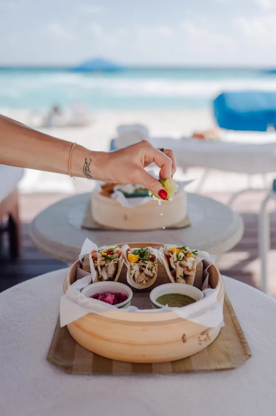 Beachside tacos with sauces and lime at Kempinski Hotel Cancún.