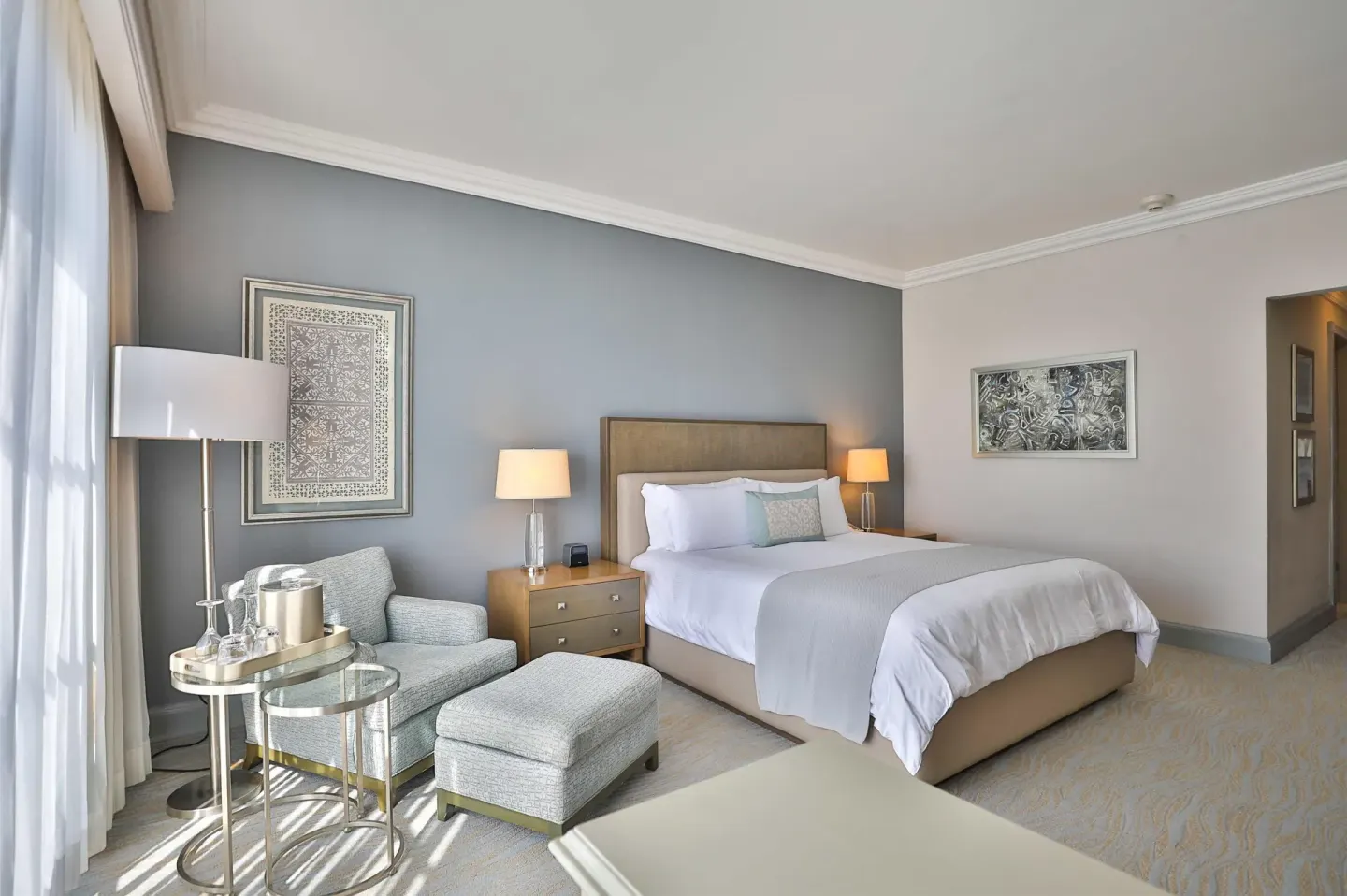 Deluxe seafront king room with seating area at Kempinski Hotel Cancún.