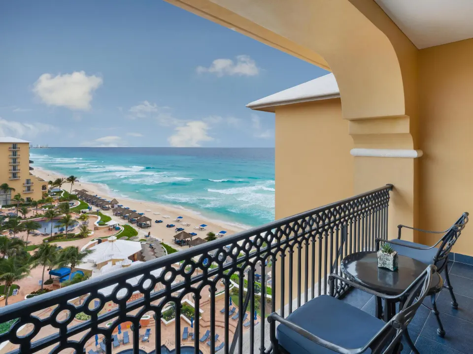 Seaside Deluxe Room balcony with ocean and beach view at Kempinski Hotel Cancún.