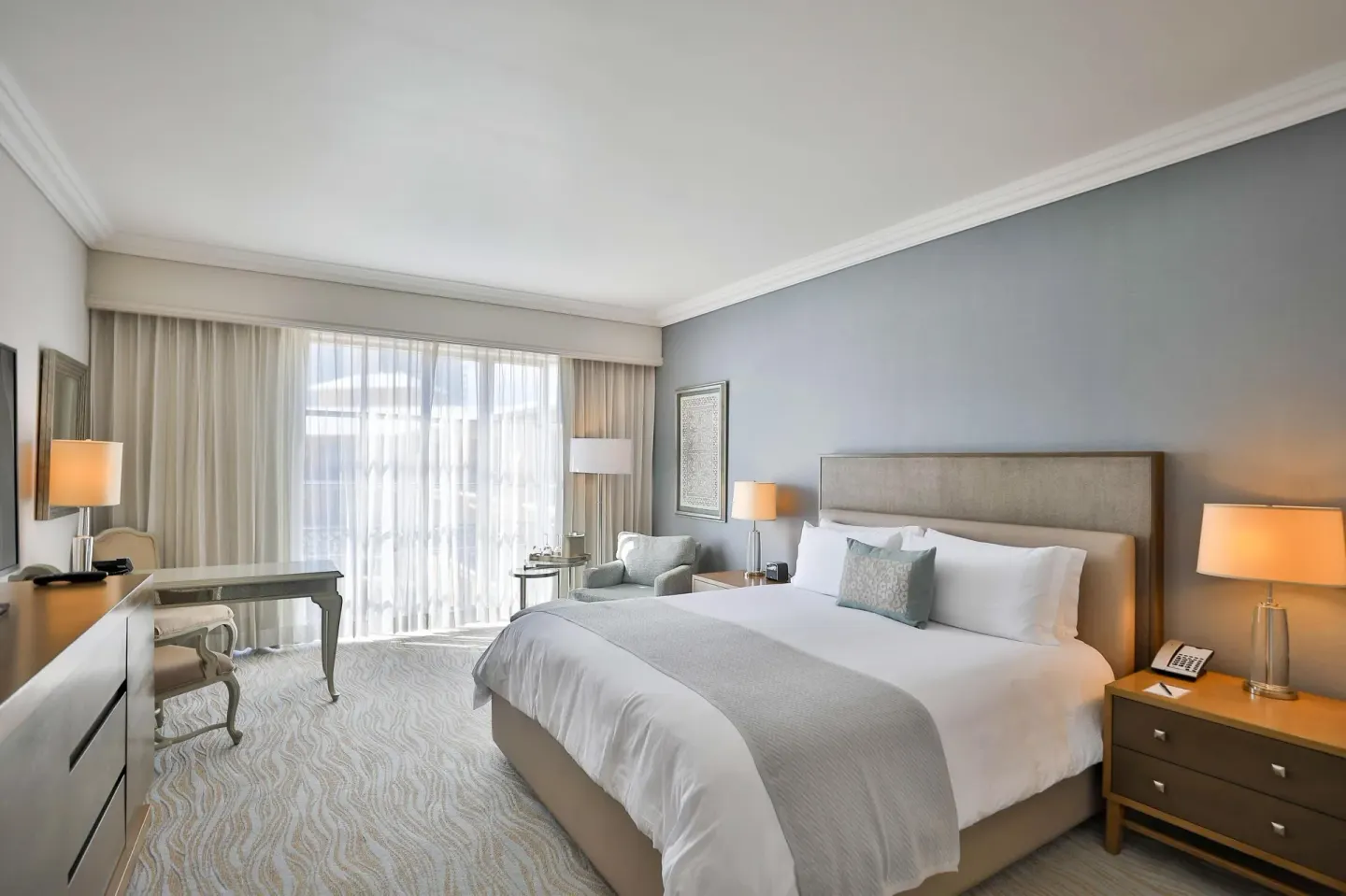 Deluxe seaside room with king bed and desk at Kempinski Hotel Cancún.