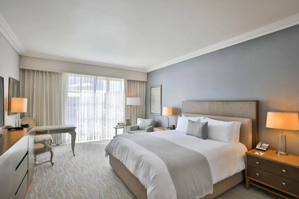 Deluxe seaside room with king bed and desk at Kempinski Hotel Cancún.