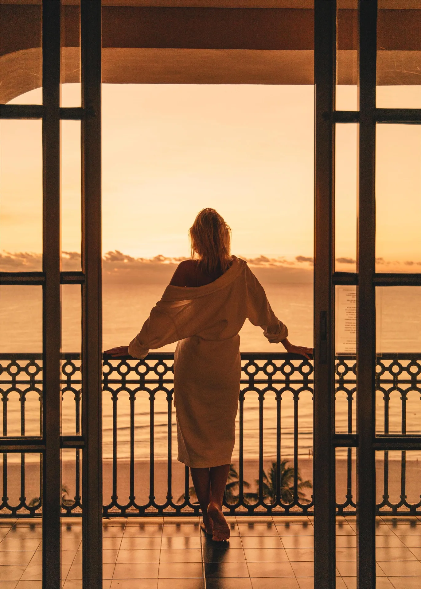 Panoramic Suite balcony at sunset overlooking the ocean at Kempinski Hotel Cancún.