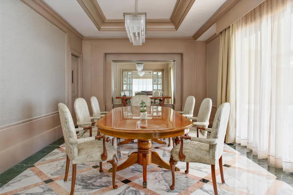 Presidential Suite dining room with round table and upholstered chairs at Kempinski Hotel Cancún.