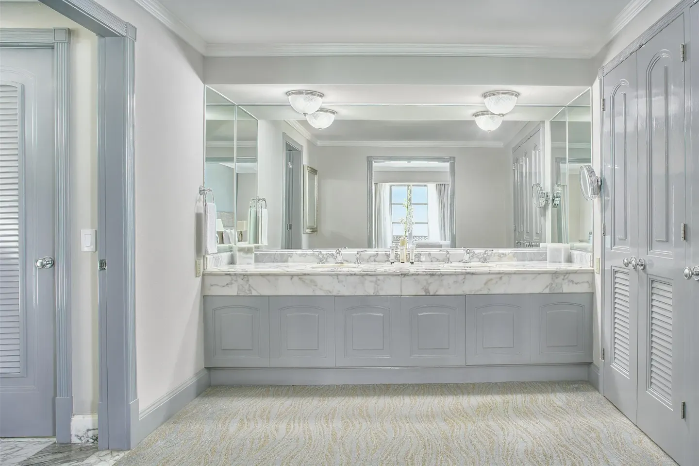 Seafront suite bathroom vanity with double sinks and large mirrors at Kempinski Hotel Cancún.
