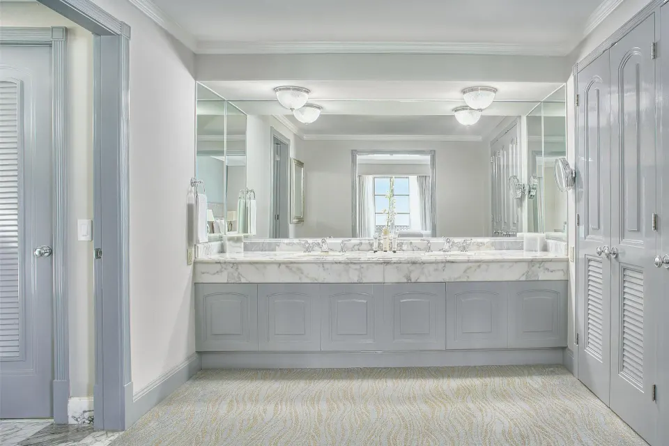 Seafront suite bathroom vanity with double sinks and large mirrors at Kempinski Hotel Cancún.