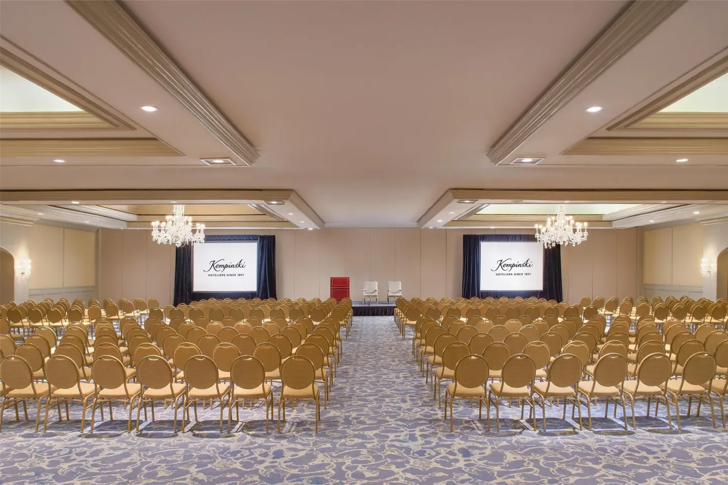 Ballroom theater seating with projection screens at Kempinski Hotel Cancún.