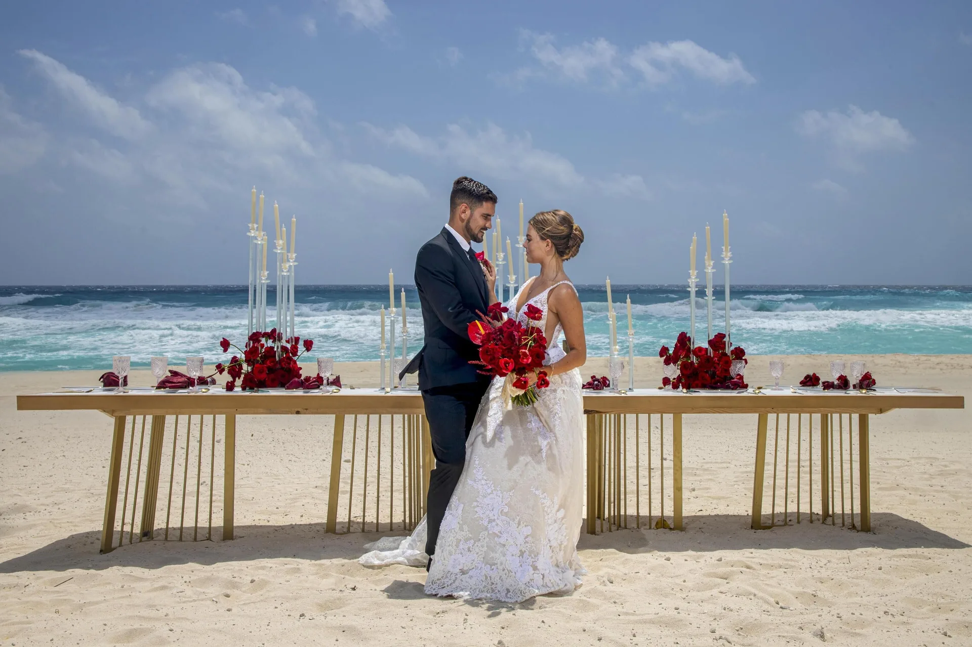 Bride and groom on a beach wedding setup at Kempinski Hotel Cancún.