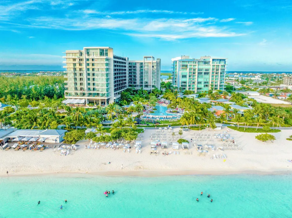 Aerial view of Kimpton Seafire Resort + Spa on Seven Mile Beach with pools and beachfront