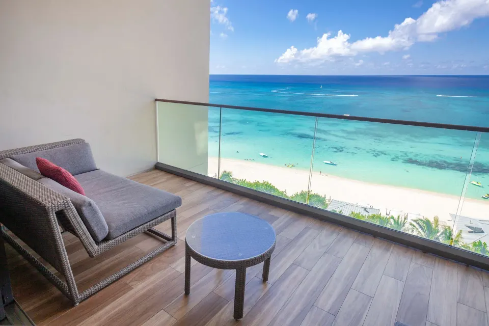 Balcony seating with ocean and beach view at Kimpton Seafire Resort + Spa