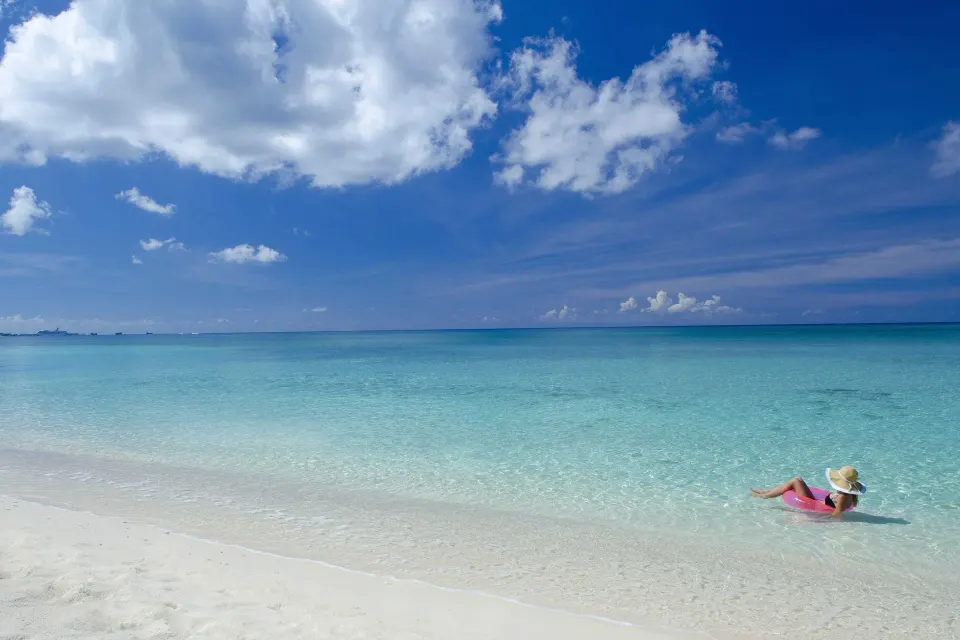 Calm turquoise water and white sand beach at Kimpton Seafire Resort + Spa