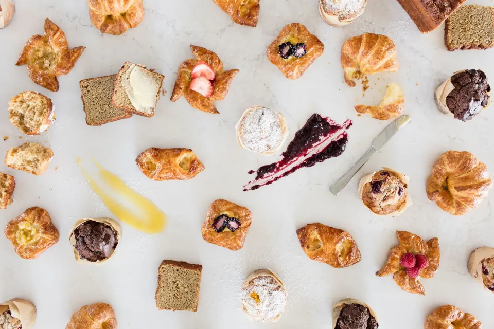 Assorted pastries and confections arranged on white paper at Kimpton Seafire Resort + Spa