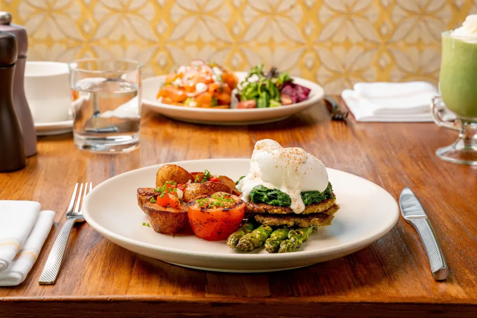 Brunch plate with eggs and roasted tomatoes at Kimpton Seafire Resort + Spa