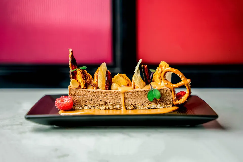 Chocolate dessert bar garnished with nuts and pretzel at Kimpton Seafire Resort + Spa