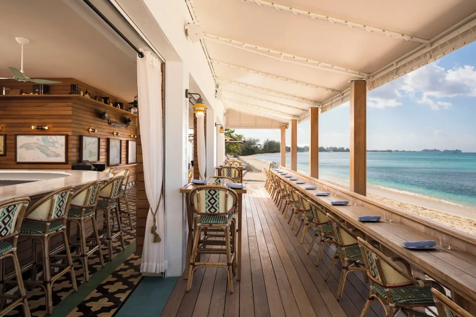 Oceanfront bar counter with stools at Kimpton Seafire Resort + Spa