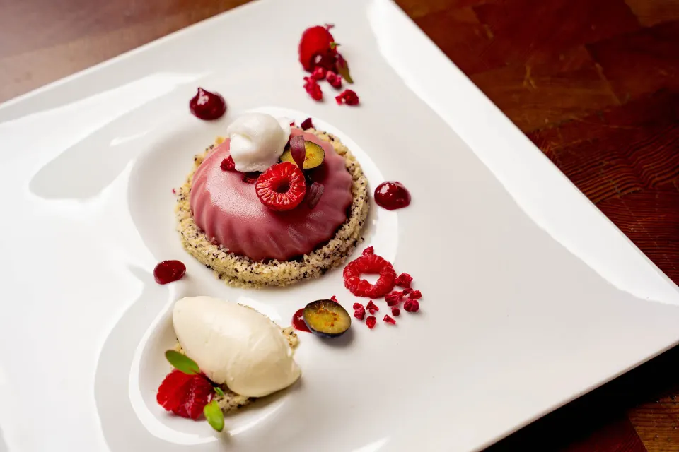Raspberry mousse dessert plated at Kimpton Seafire Resort + Spa