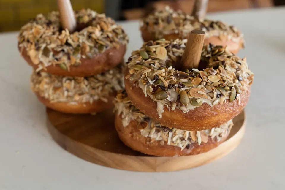 Stacked doughnuts topped with seeds and coconut at Kimpton Seafire Resort + Spa