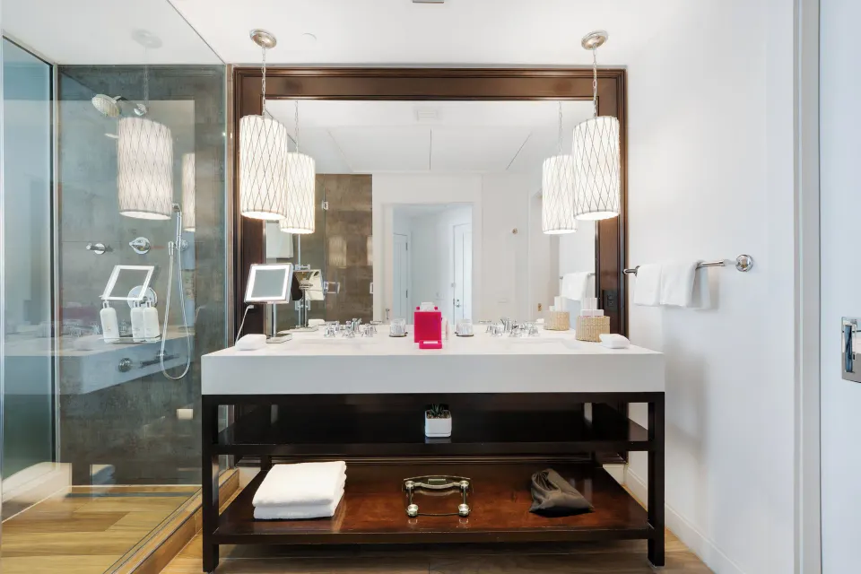 Bathroom vanity and glass shower in an Ocean View Room at Kimpton Seafire Resort + Spa