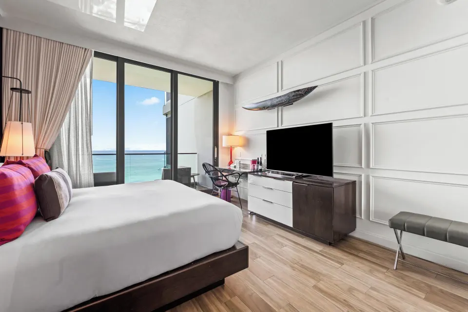 Ocean View Room showing bed, TV console and balcony with sea view at Kimpton Seafire Resort + Spa