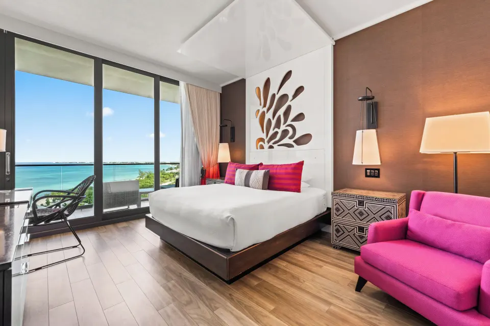 Premium Ocean View King room angled view showing bed and balcony at Kimpton Seafire Resort + Spa