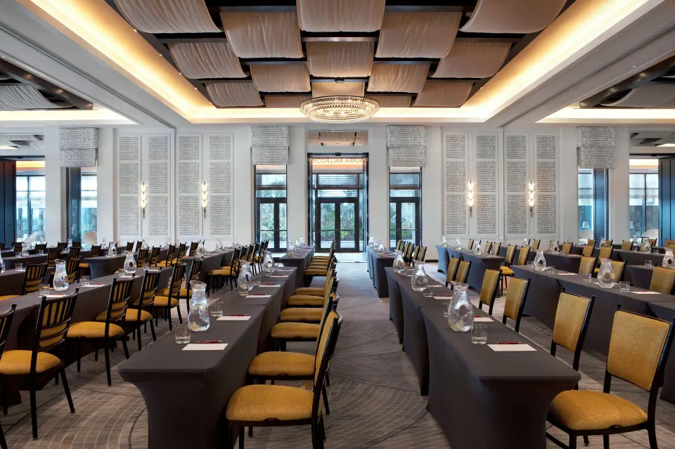 Classroom-style meeting room with rows of chairs and notepads at Kimpton Seafire Resort + Spa
