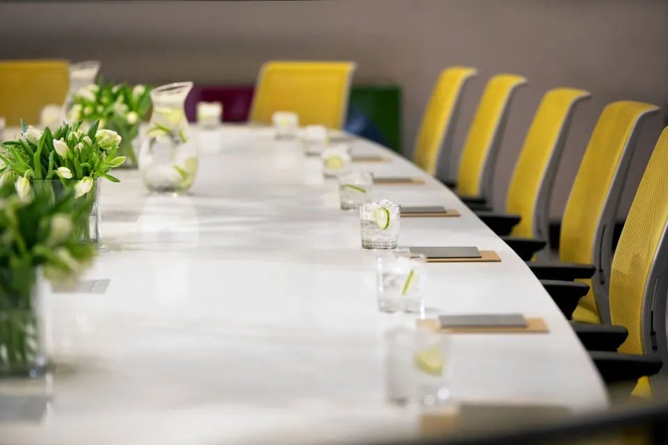 Conference table set with notepads and water glasses at Kimpton Seafire Resort + Spa