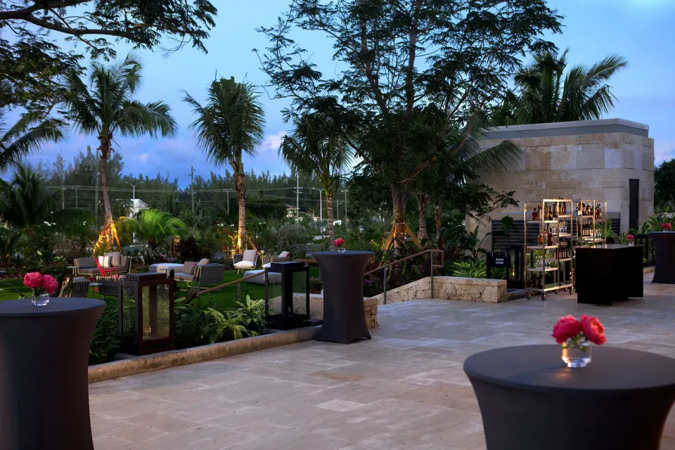 Terrace event setup with cocktail tables and evening lighting at Kimpton Seafire Resort + Spa