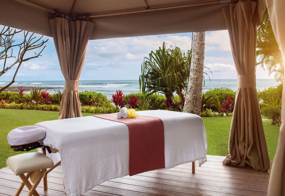 Outdoor massage table in an oceanfront cabana at Ko'a Kea Resort on Po'ipu Beach.
