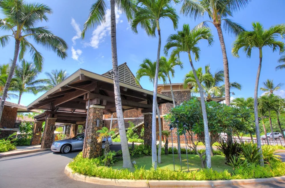 Palm-lined resort entrance and porte cochere at Ko'a Kea Resort on Po'ipu Beach.