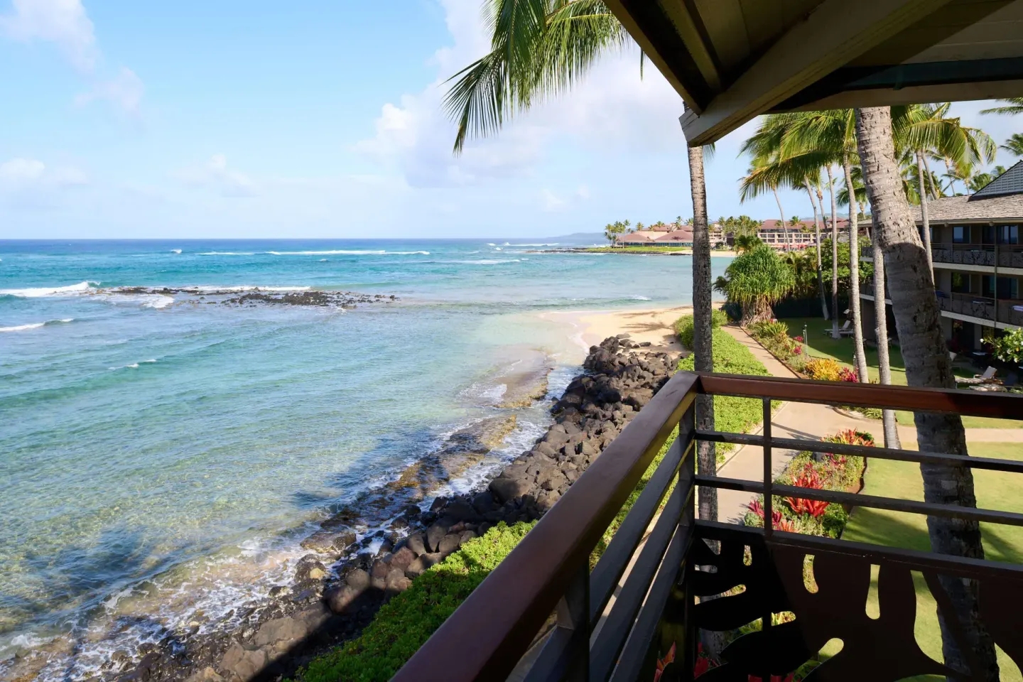 Oceanfront balcony view over Po'ipu Beach at Ko'a Kea Resort on Po'ipu Beach.