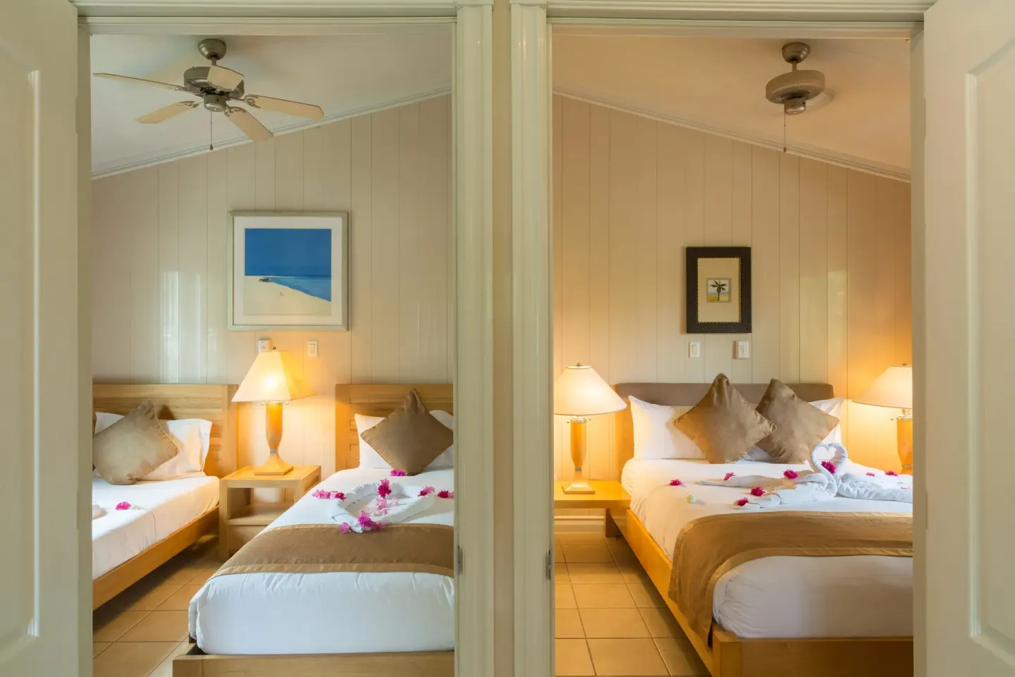 Adjoining bedrooms with twin beds and a king bed at Kokomo Botanical Resort.