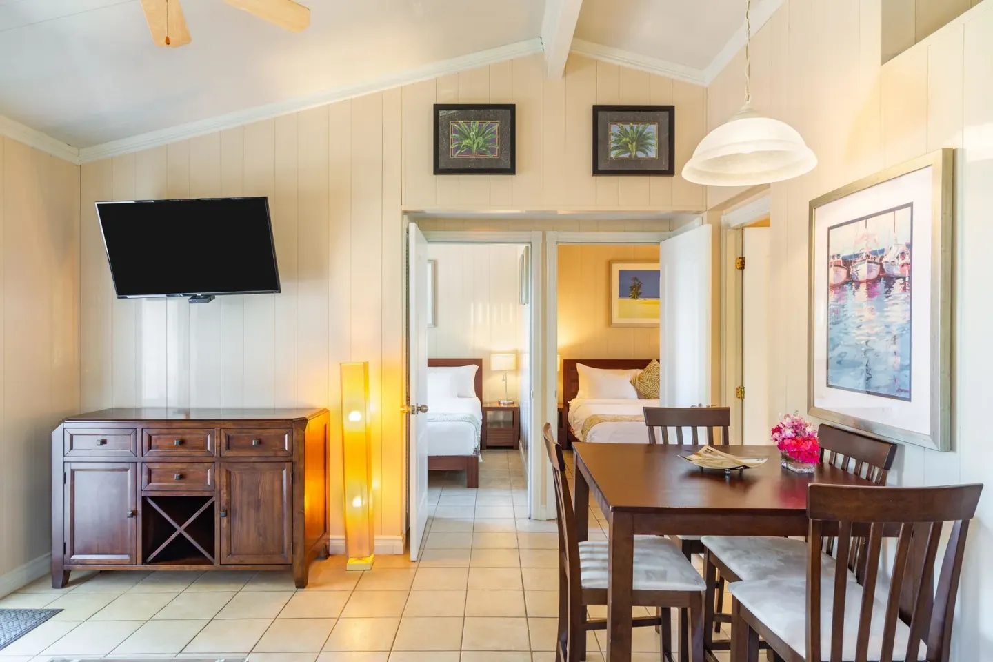 Suite dining area with open doors to bedrooms at Kokomo Botanical Resort.