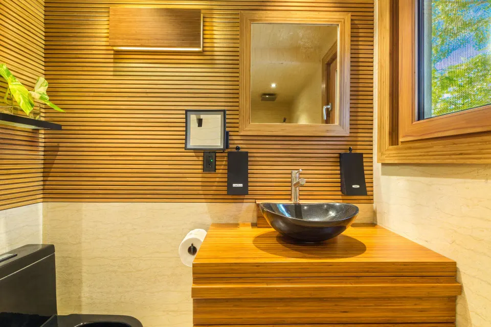 Superior Cottage bathroom vanity with black vessel sink at Kokomo Botanical Resort.