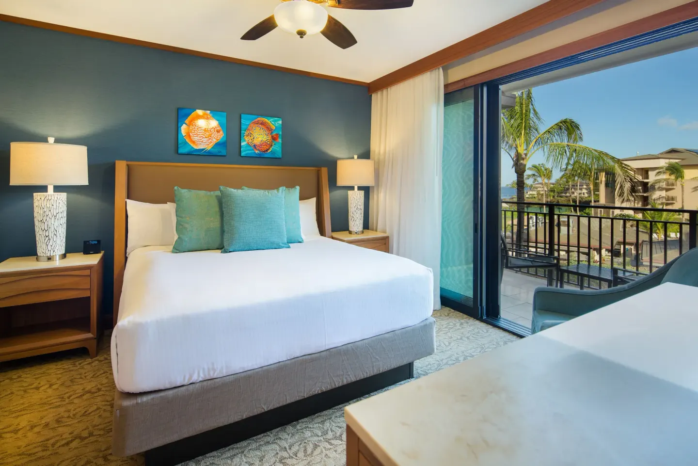 Guest room with king bed and balcony view at Koloa Landing Resort at Poipu.