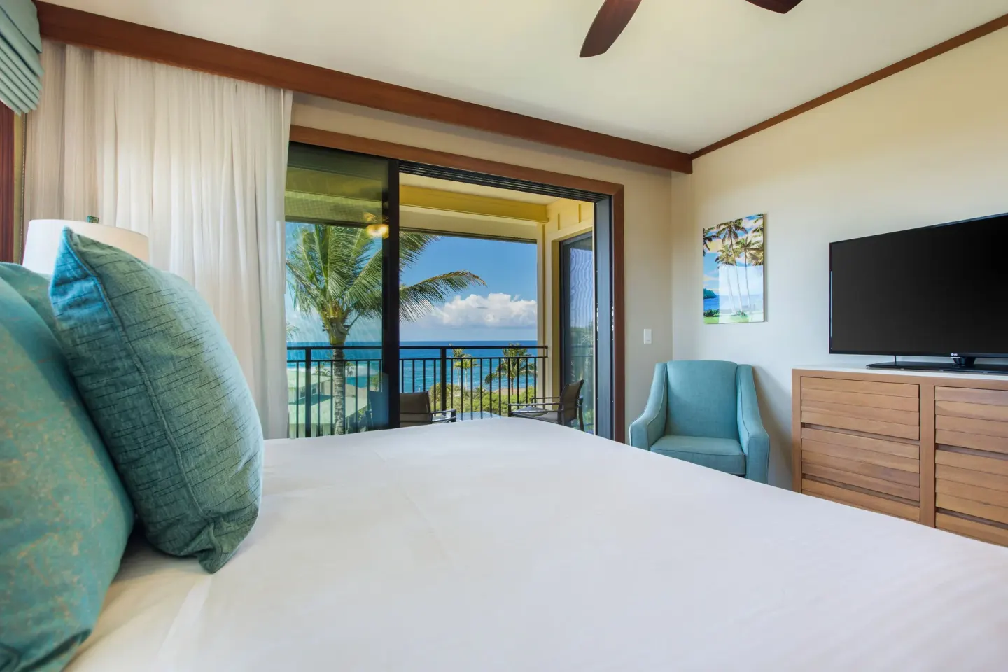 Ocean-view guest room with king bed and balcony at Koloa Landing Resort at Poipu.