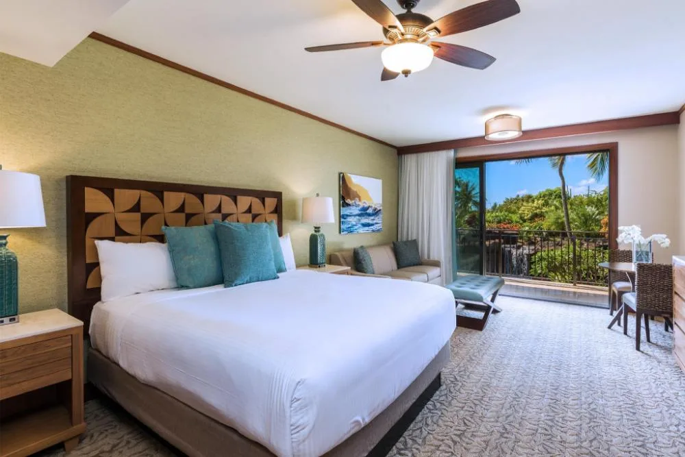Studio king bed and balcony seating at Koloa Landing Resort at Poipu.