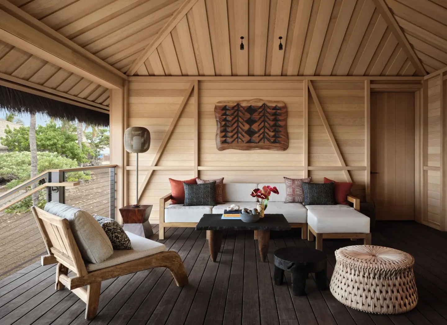 Covered guest room lanai with sofa seating and wood ceiling at Kona Village.
