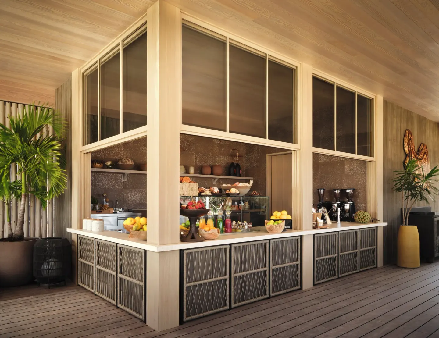 A market-style counter displays fruit, pastries and coffee equipment at Kona Village.