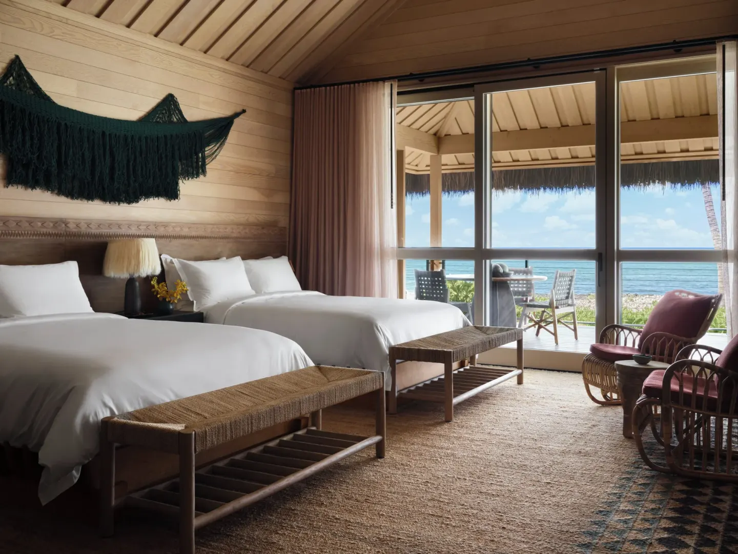 Beach Front Two Queens Hale guest room with ocean-facing lanai at Kona Village.