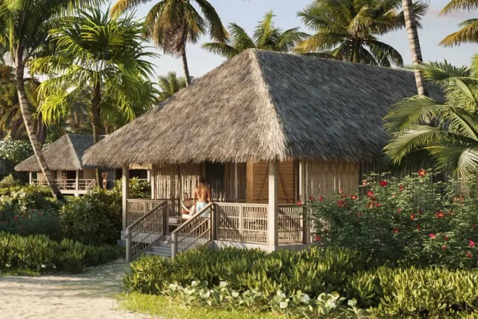 Beach Room Front Hale exterior with thatched roof and tropical landscaping at Kona Village.