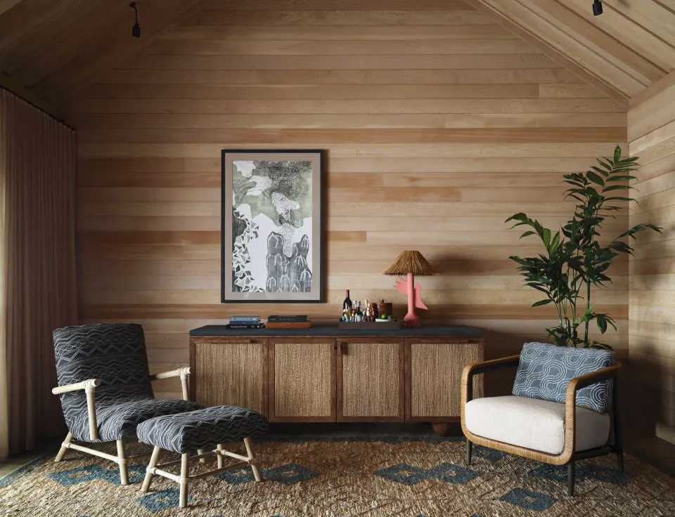 Wood-paneled sitting area in a Garden View One Bedroom Kauhale at Kona Village.