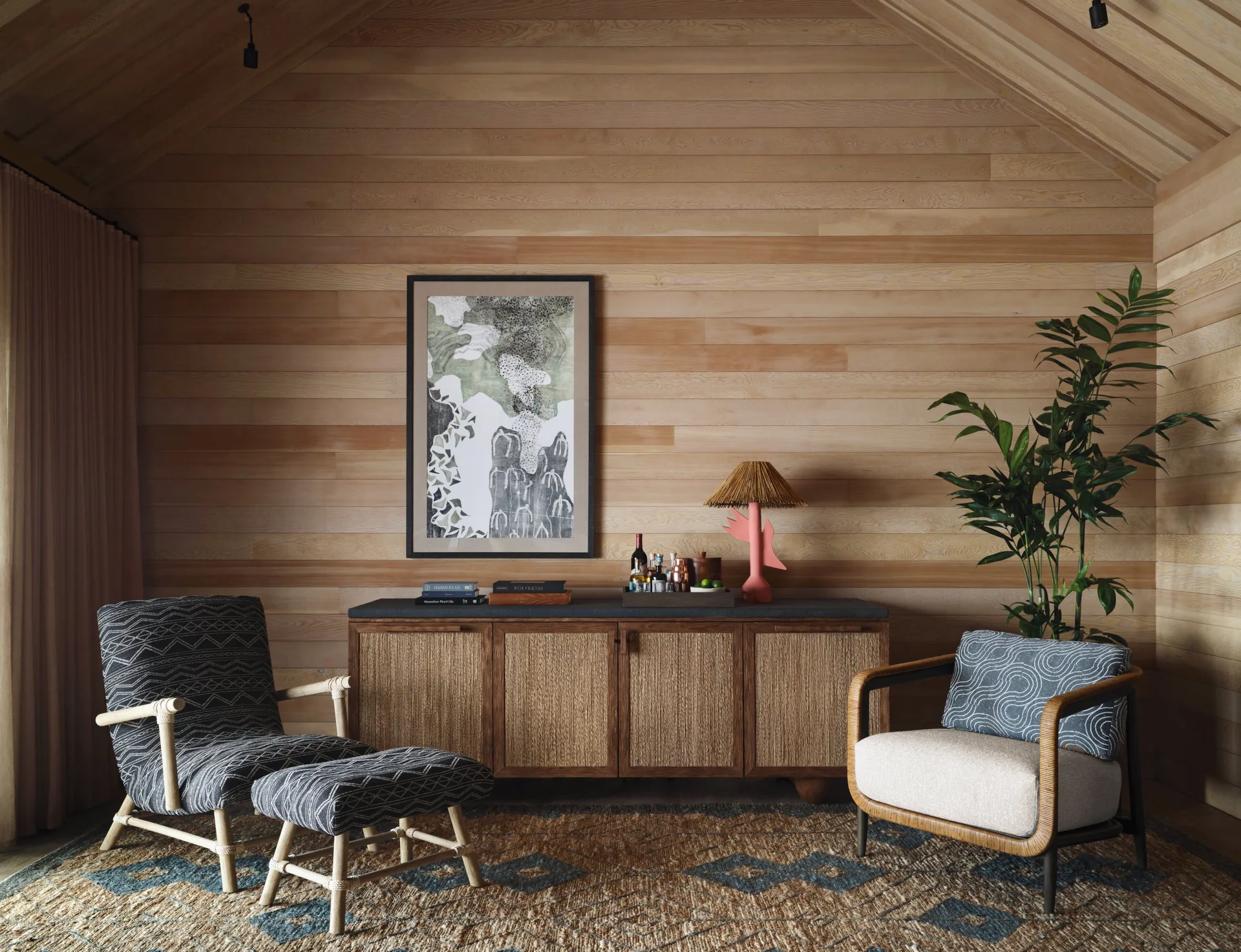 Wood-paneled sitting area in a Garden View One Bedroom Kauhale at Kona Village.