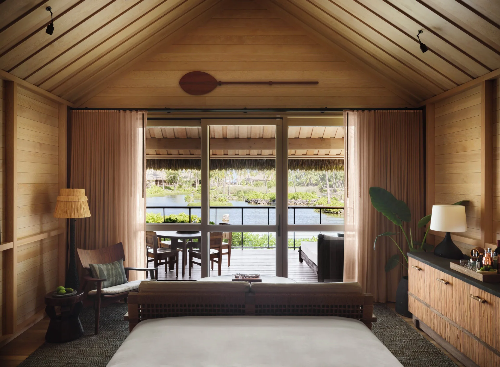 Lagoon View Hale Room at Kona Village with king bed, lanai overlooking the lagoon, and traditional Hawaiian hale design on the Big Island.