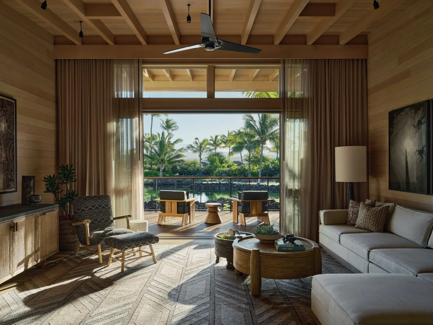 Mountain View One Bedroom Kauhale living room with lanai and palm view at Kona Village.