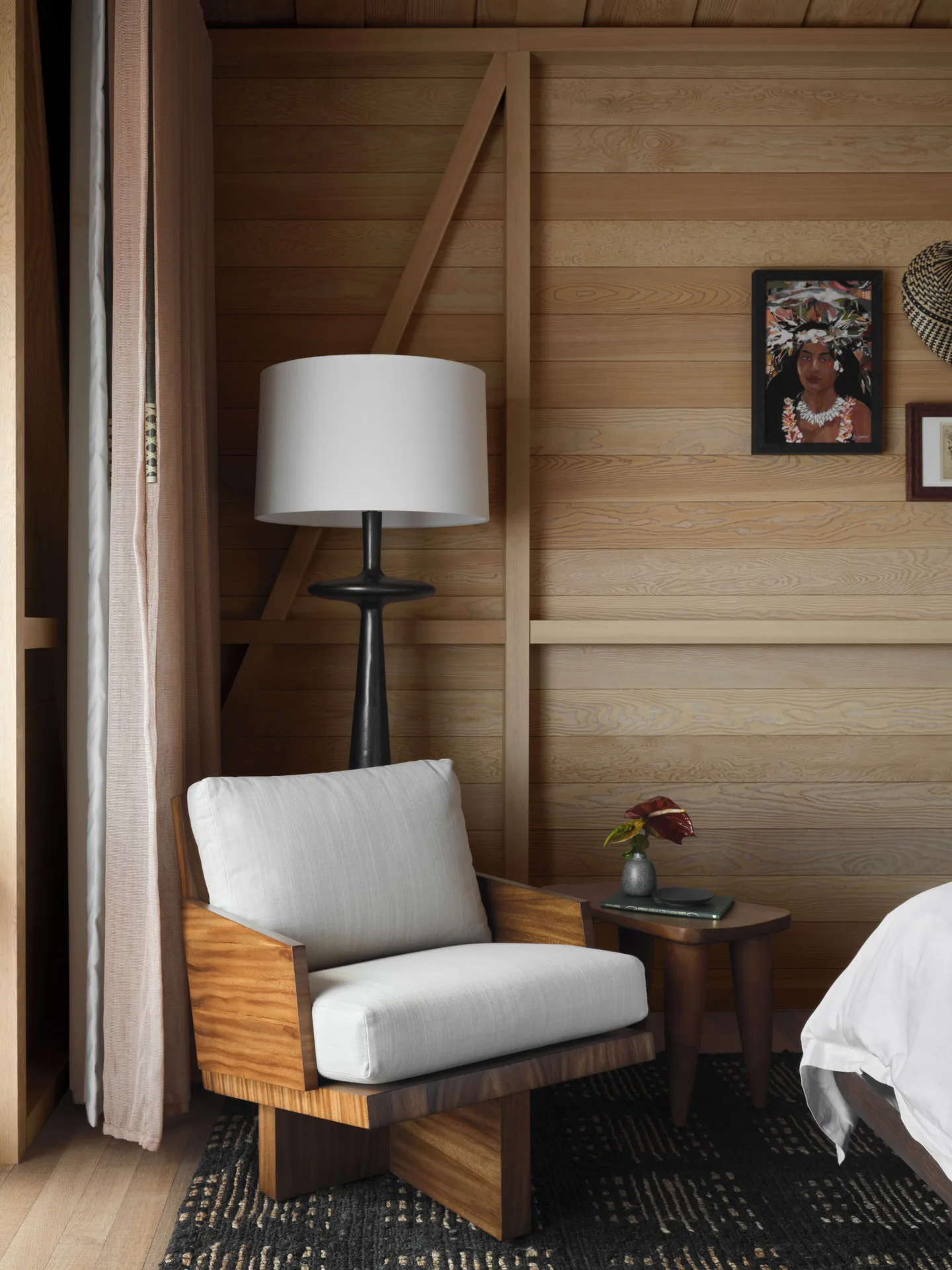 Bedroom seating nook in an Ocean Front Black Sand Two Bedroom Kauhale at Kona Village.