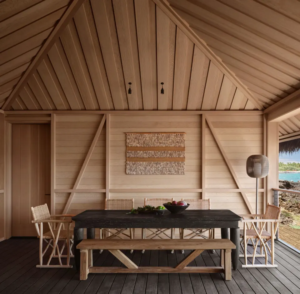 Covered dining lanai in an Ocean Front Black Sand Two Bedroom Kauhale at Kona Village.