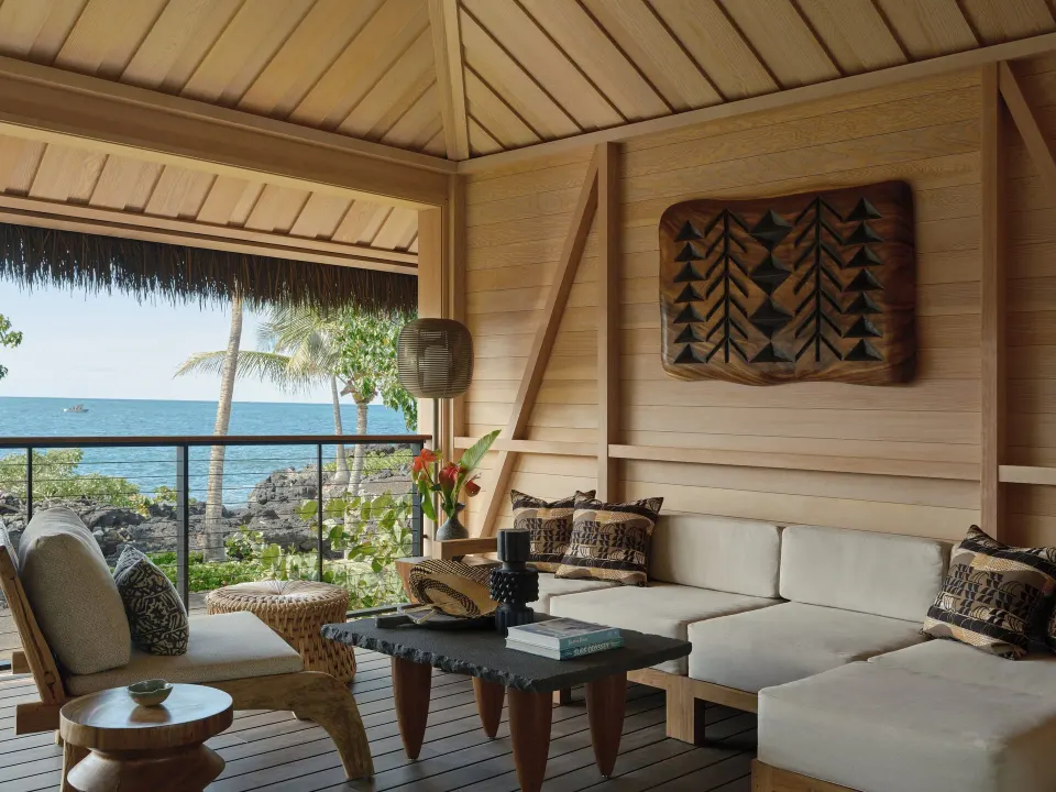 Oceanfront lanai lounge in an Ocean Front Black Sand Two Bedroom Kauhale at Kona Village.